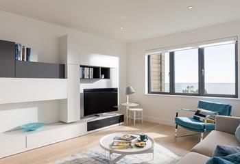 Sit in the stylish sitting room and enjoy the waves.