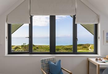 Open the blinds each morning to see the sun shining on the sea.