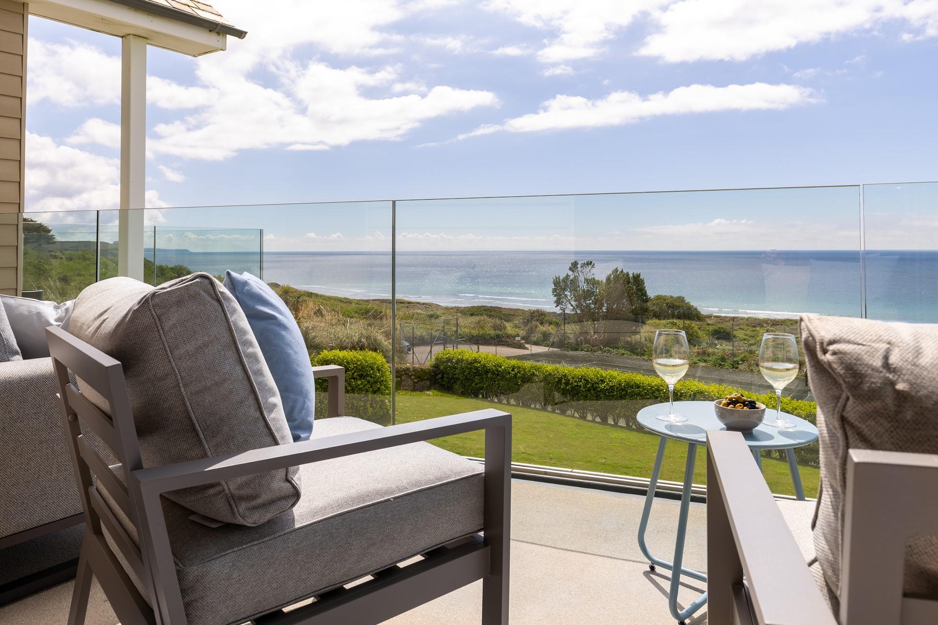 Take drinks and nibbles onto the balcony and enjoy the sea views.