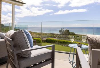 Take drinks and nibbles onto the balcony and enjoy the sea views.