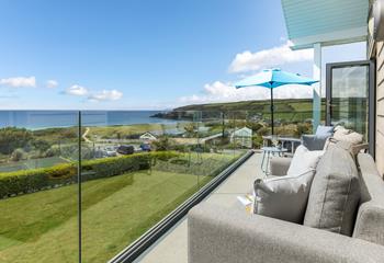 Snuggle up on the outdoor sofa and watch the sun set over the ocean.