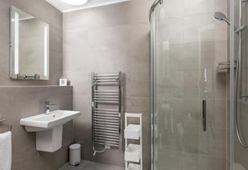 The modern en suite shower room is perfect for a post-swim rinse!