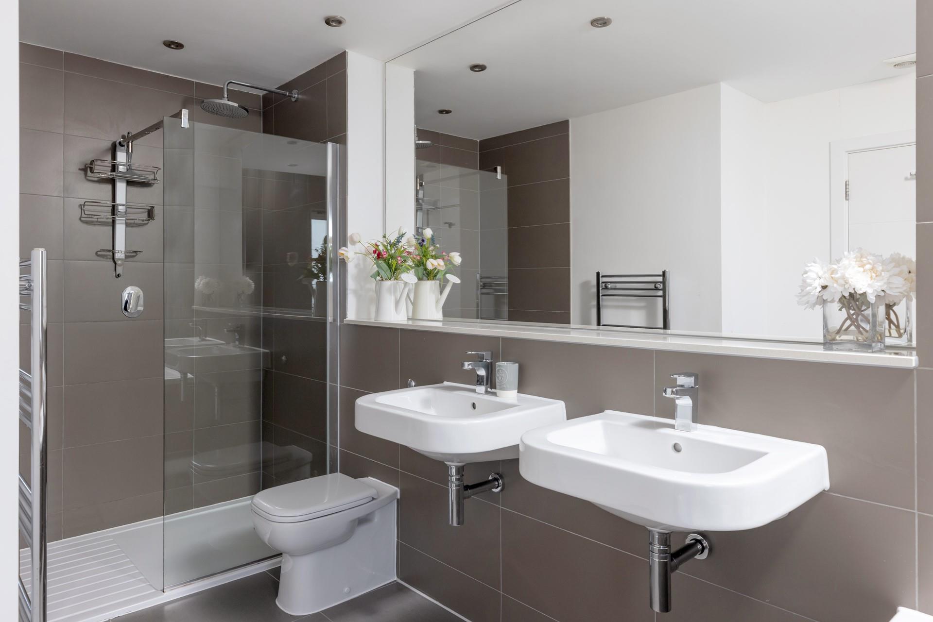 The spacious bathroom is the perfect place to get ready for the day. 