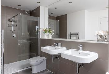 The spacious bathroom is the perfect place to get ready for the day. 