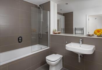 Enjoy a morning soak in the luxurious tub before starting your day.