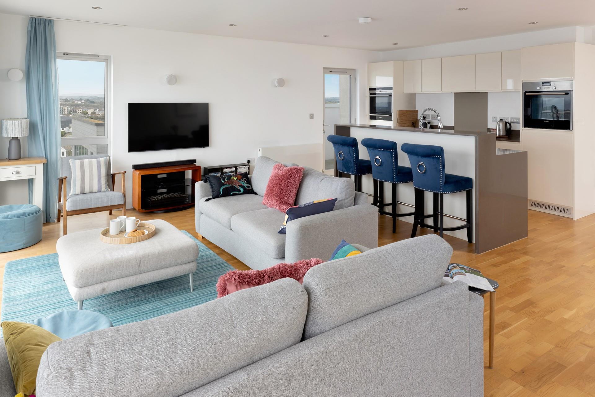 Sit back and relax in the bright living space after a day of adventures. 