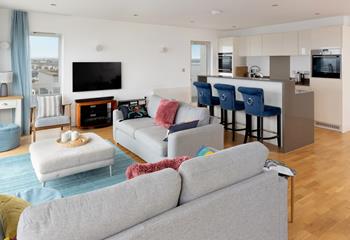 Sit back and relax in the bright living space after a day of adventures. 