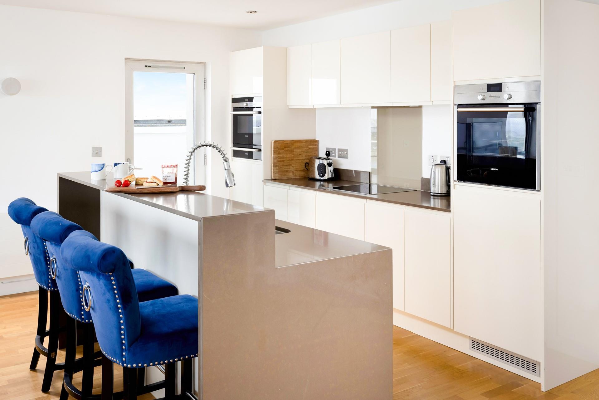 The kitchen area offers space for cooking and socialising together.