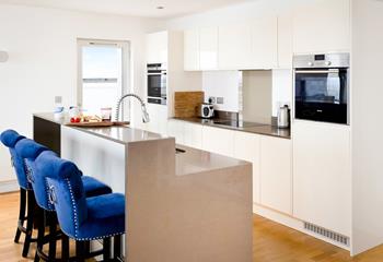 The kitchen area offers space for cooking and socialising together.