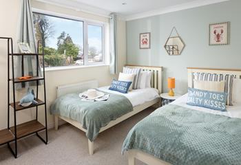 The twin beds are the perfect place for kids to unwind after a day of exploring. 