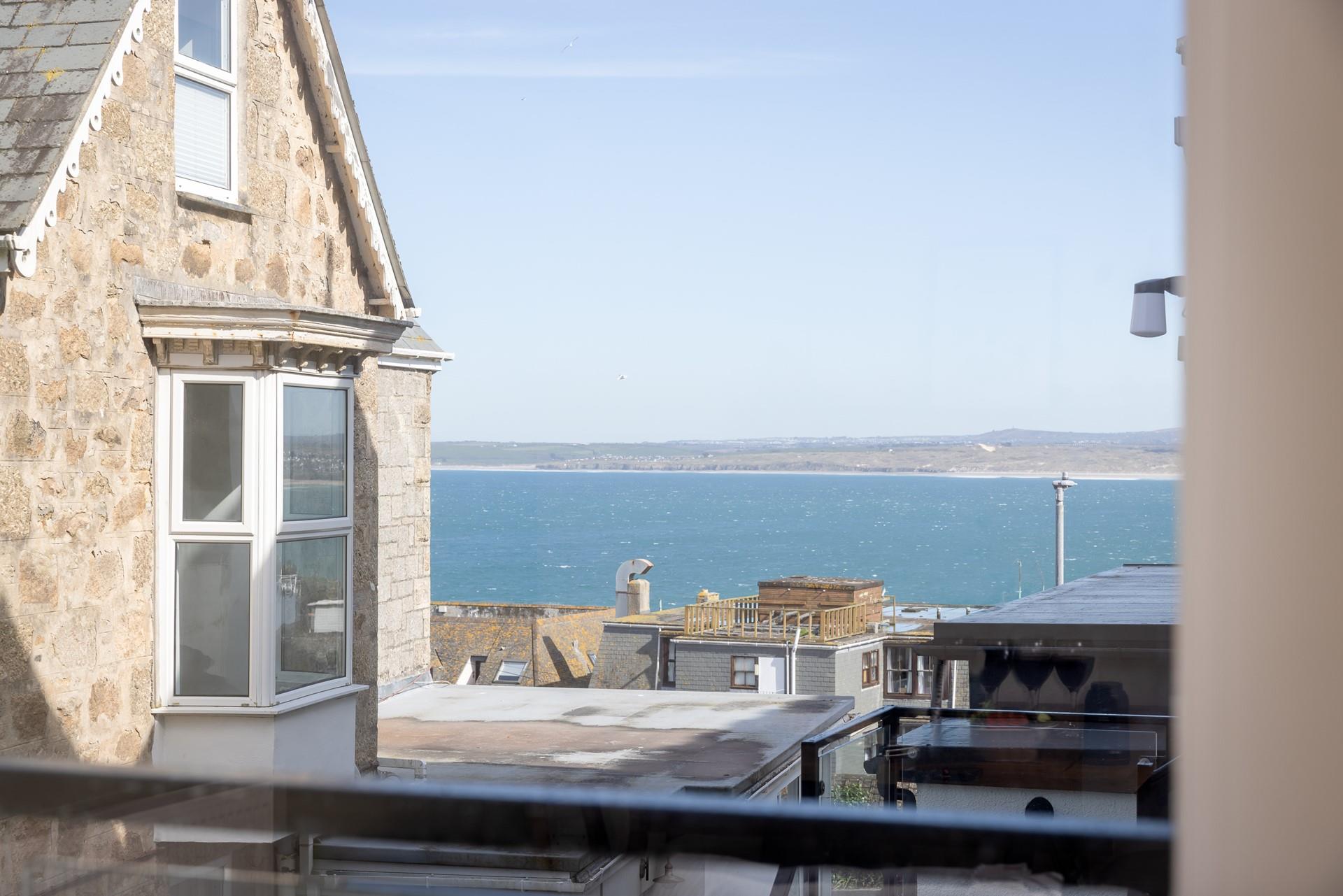 Watch the sun set over the rooftops. 