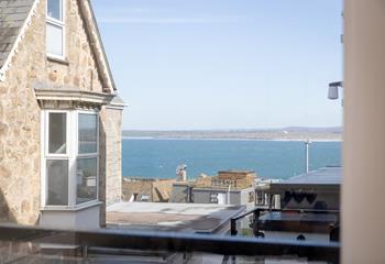 Watch the sun set over the rooftops. 