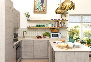 The contemporary kitchen is well-equipped and a joy to cook in!