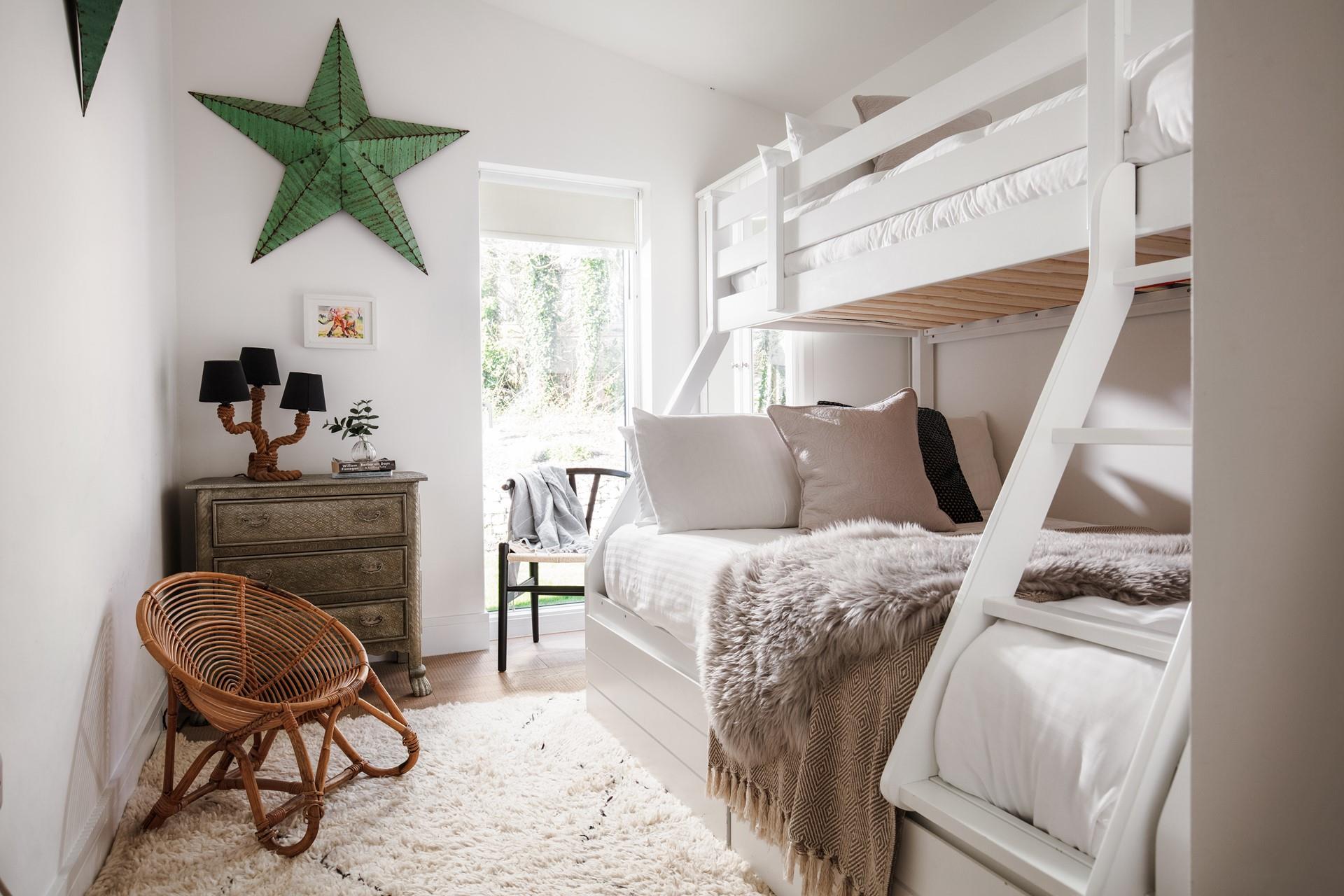 Bedroom 2 has a double with a single top bunk, ideal for families and flexible sleeping arrangements.