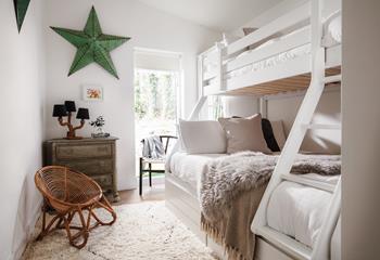 Bedroom 2 has a double with a single top bunk, ideal for families and flexible sleeping arrangements.