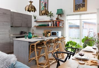 The contemporary kitchen is well-equipped and a joy to cook in!