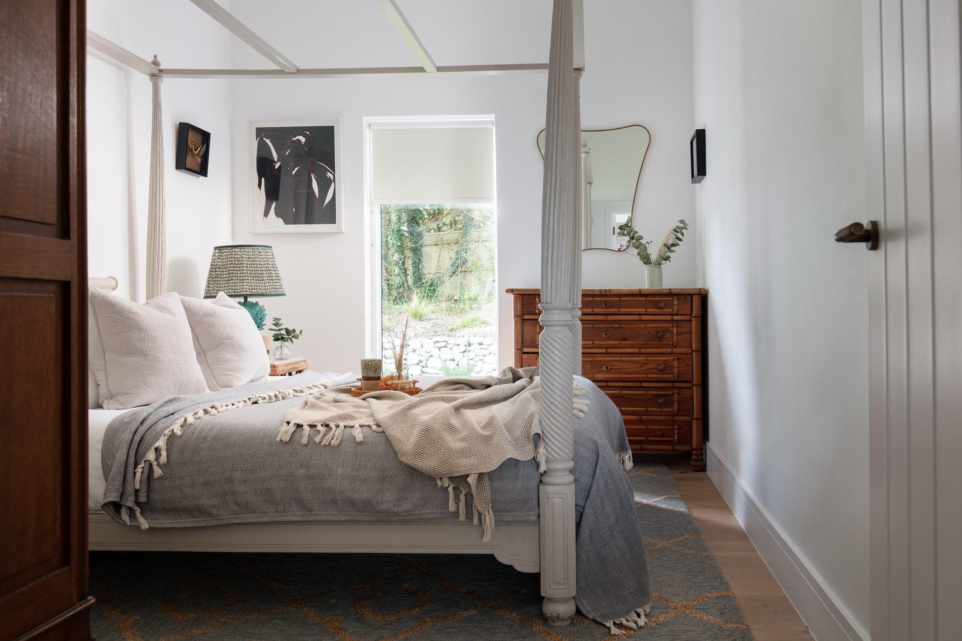 Bedroom 1 has direct access and a view of the pretty garden.