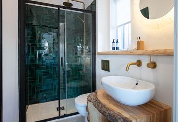 The contemporary en suite combines rustic features with modern facilities.