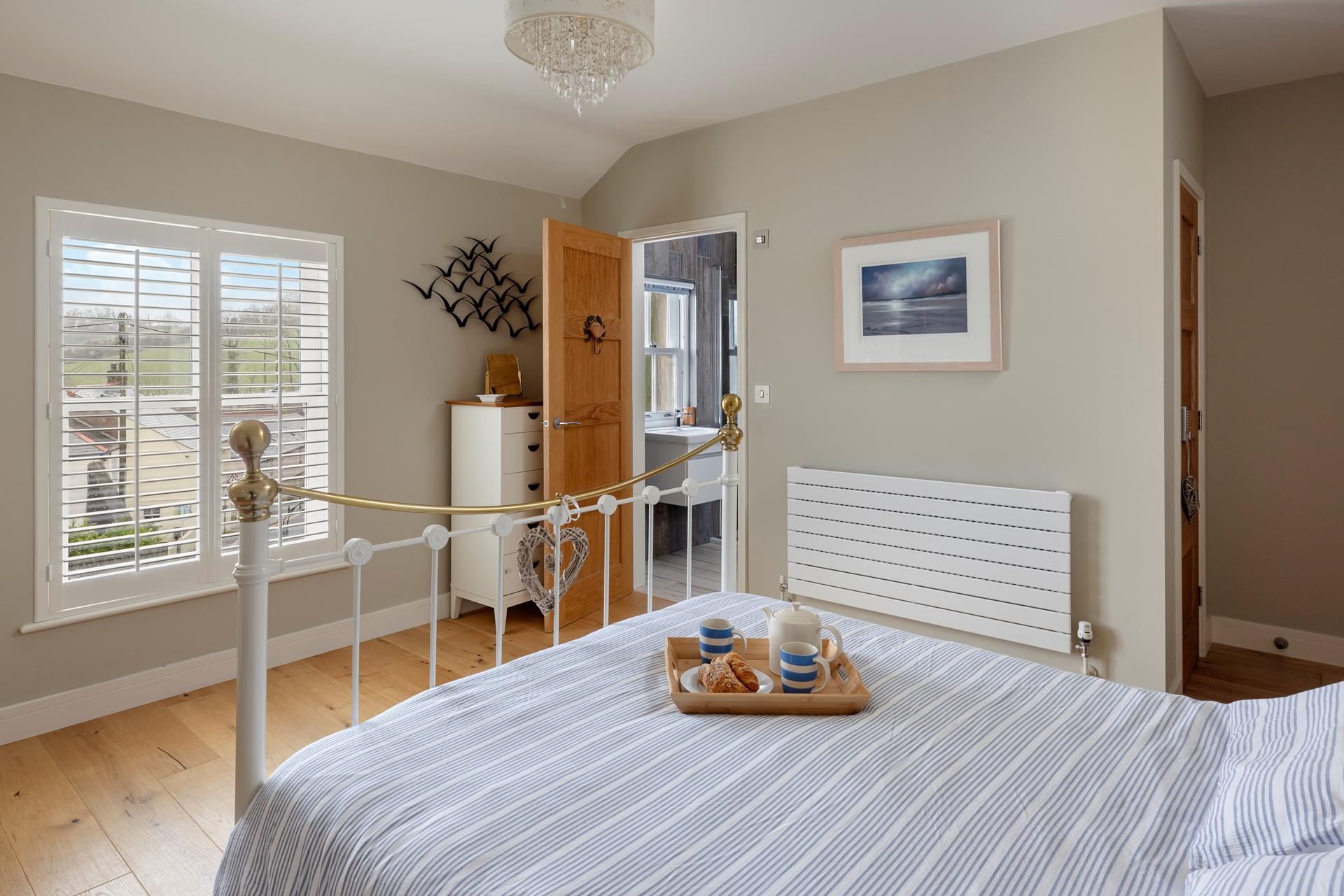 Bedroom 1 is spacious and has an en suite.