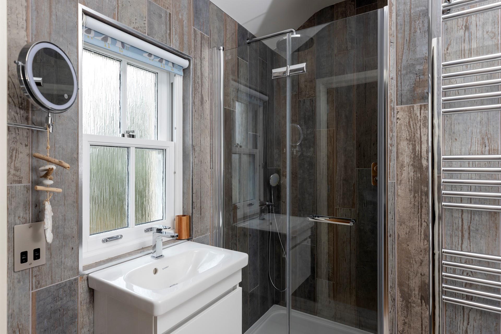 The en suite shower room is ideal for washing the day away each evening.