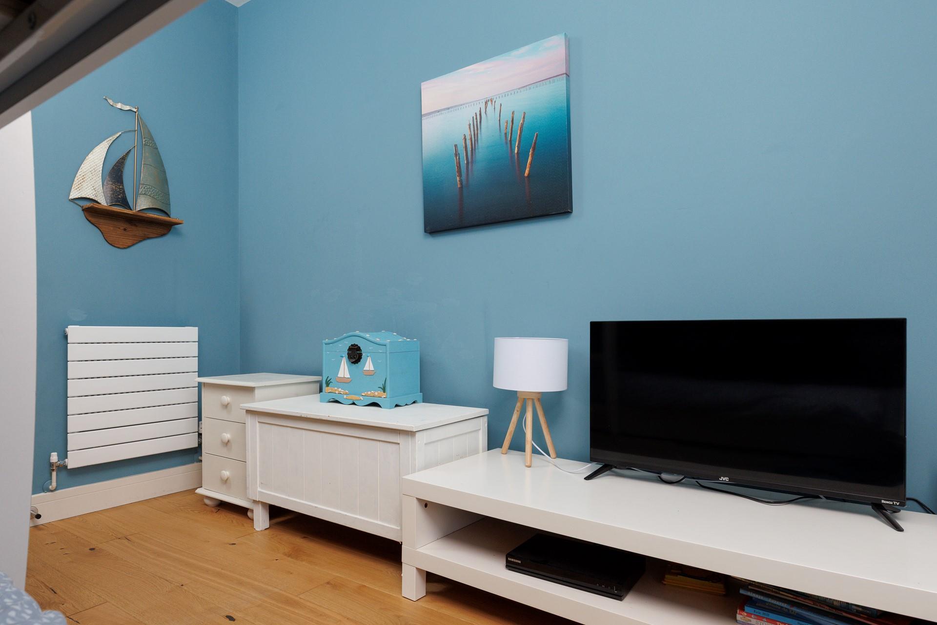 Little ones can relax in the bunk room after days of fun on a nearby beach.
