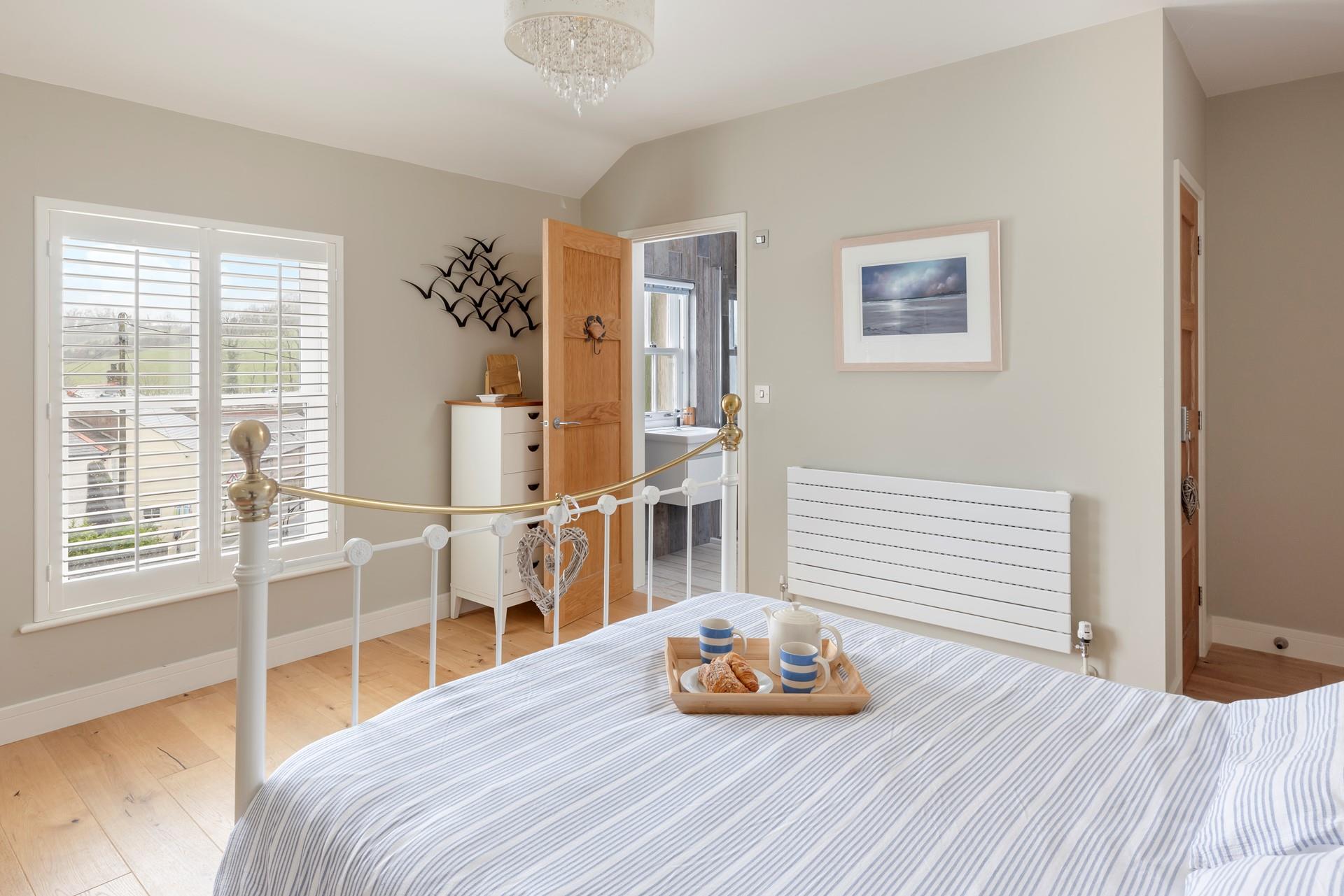 Bedroom 1 is spacious and has an en suite.