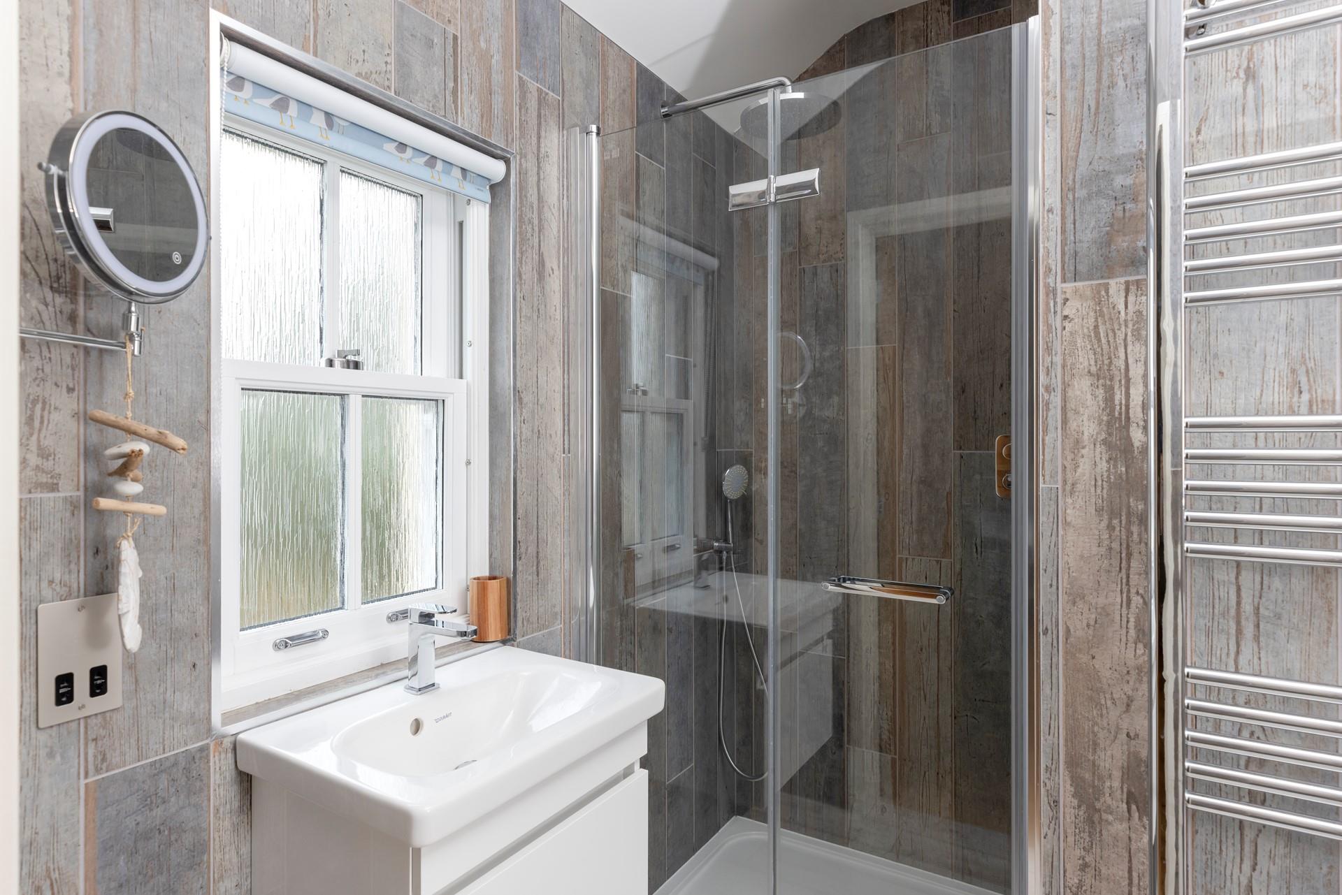 The en suite shower room is ideal for washing the day away each evening.