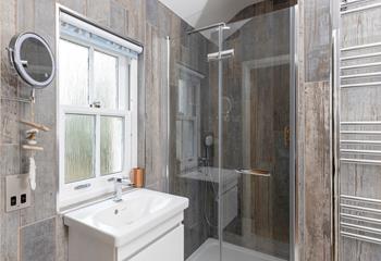 The en suite shower room is ideal for washing the day away each evening.