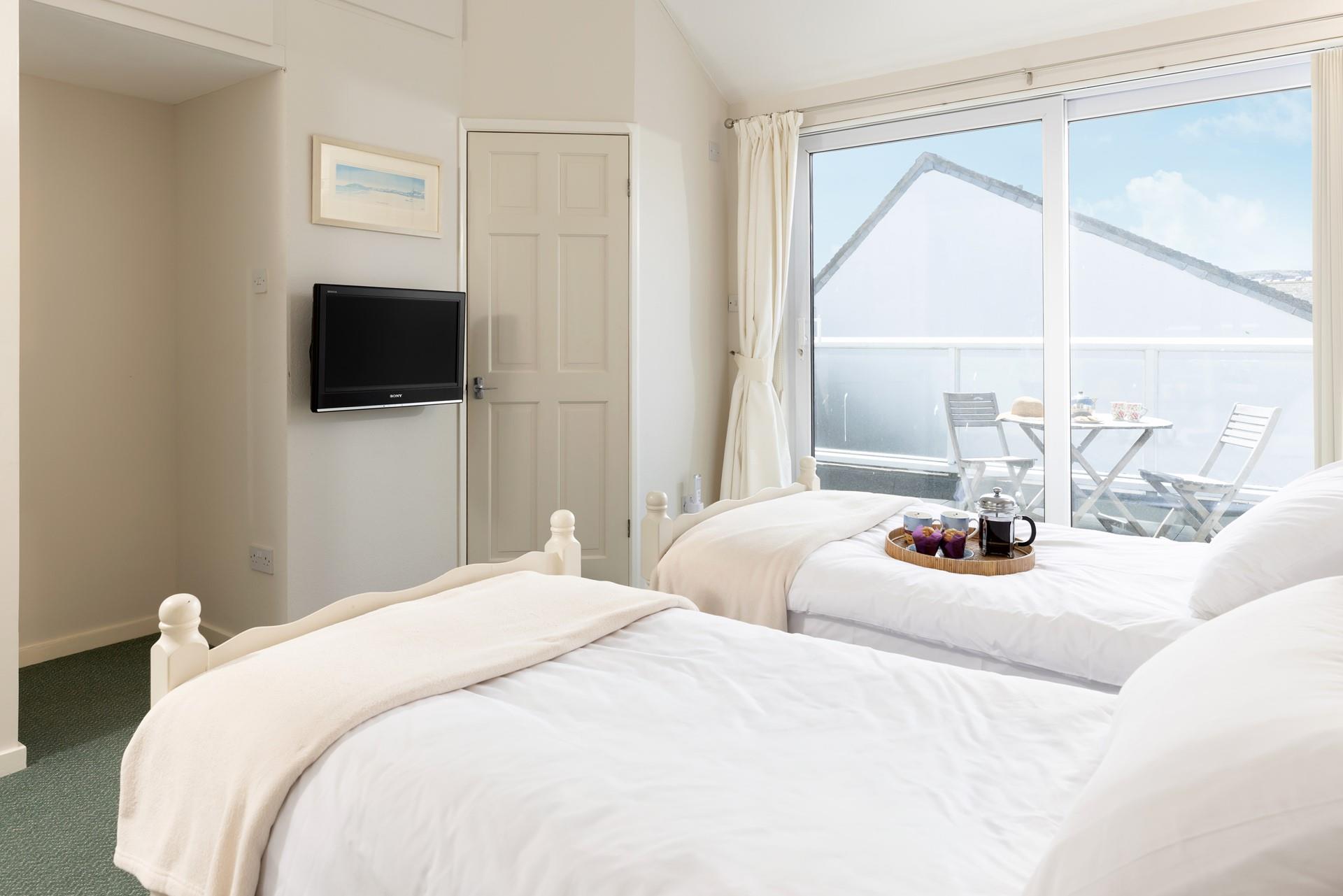 Enjoy slow mornings in this light and calming bedroom.