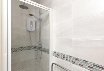 The en suite has a walk-in rainfall shower.