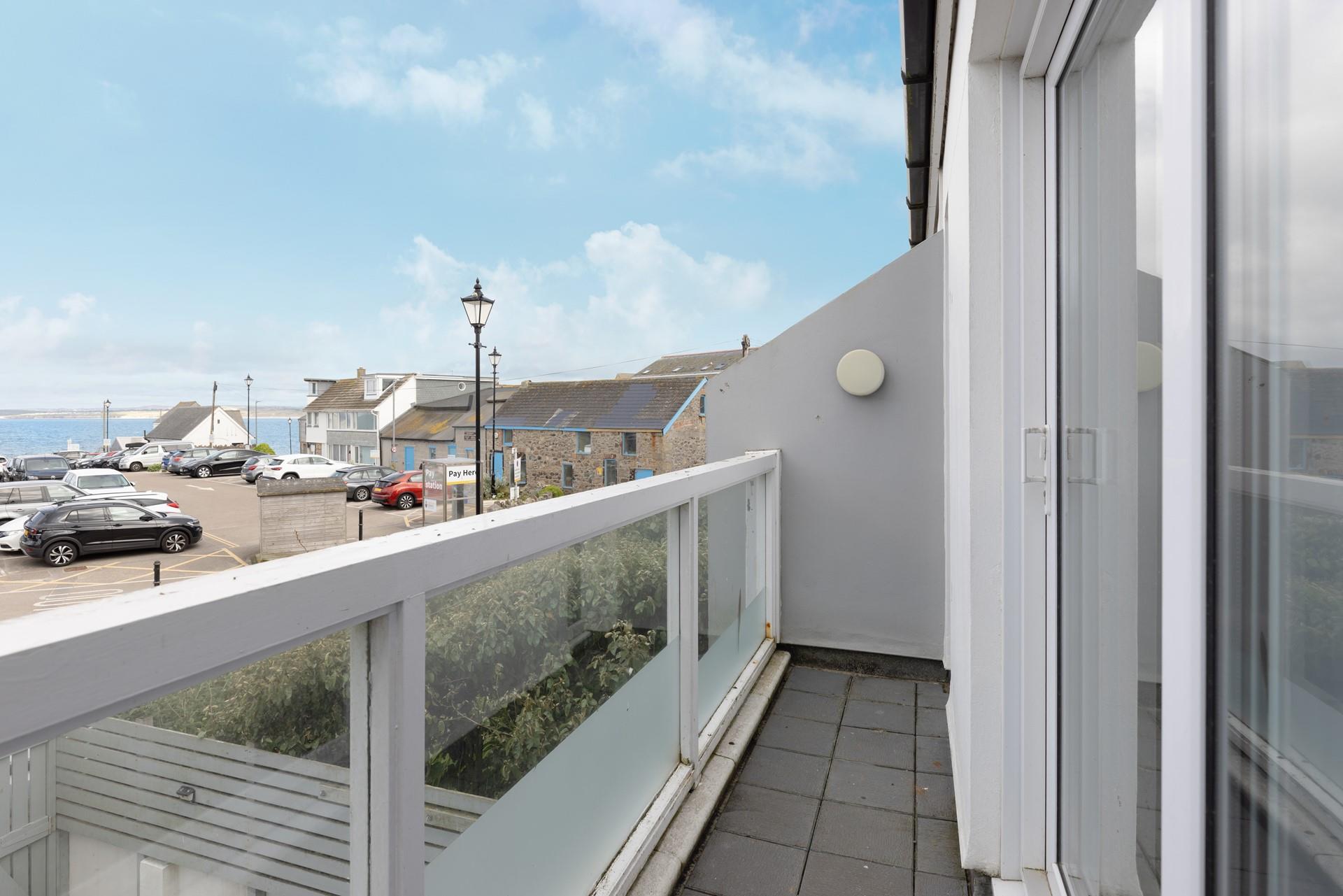 42 St Nicholas Court is a stone's throw from Porthmeor beach with sea views from the living area balcony.