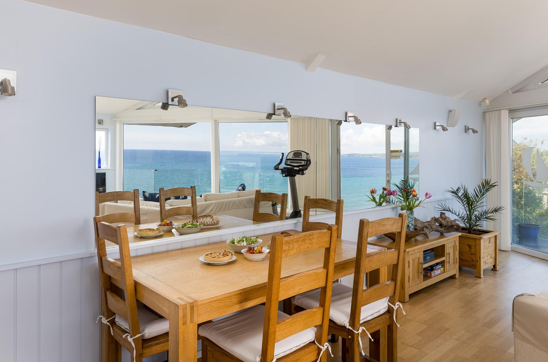Enjoy a delicious meal over the reflection of the ocean.