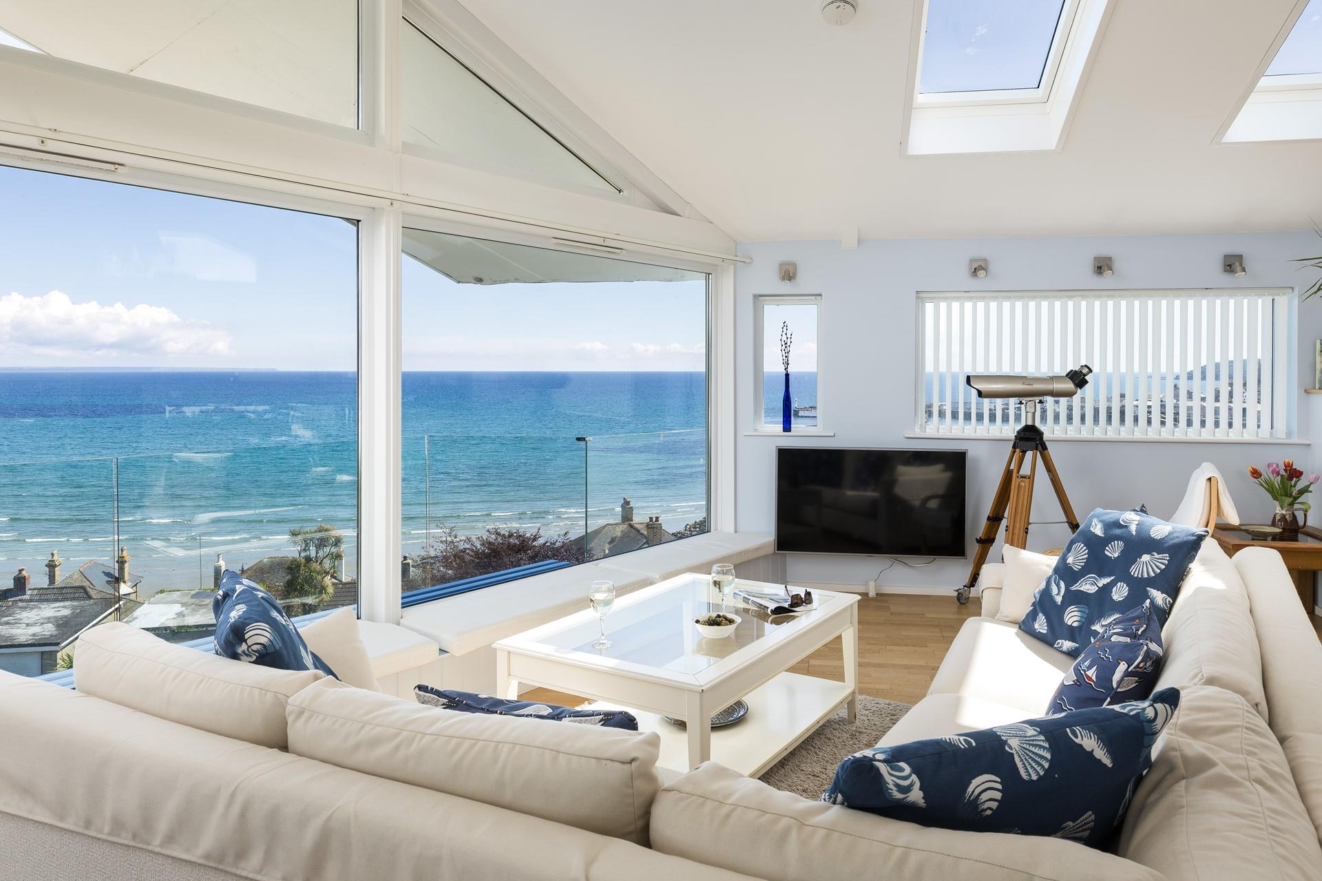 Watch the tide ebb and flow from the comfort of the plush sofa. 