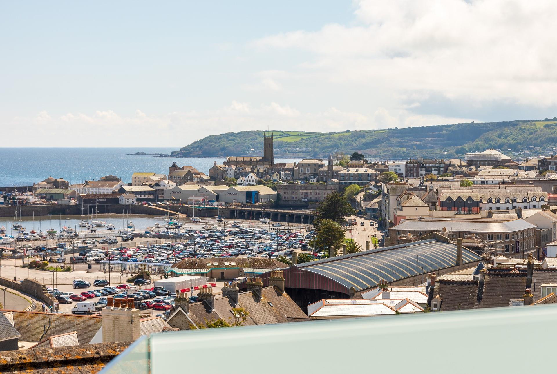 Enjoy watching the hustle and bustle of the town with views over Penzance. 