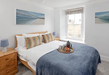 Bedroom 1 is decorated with calming coastal blues.