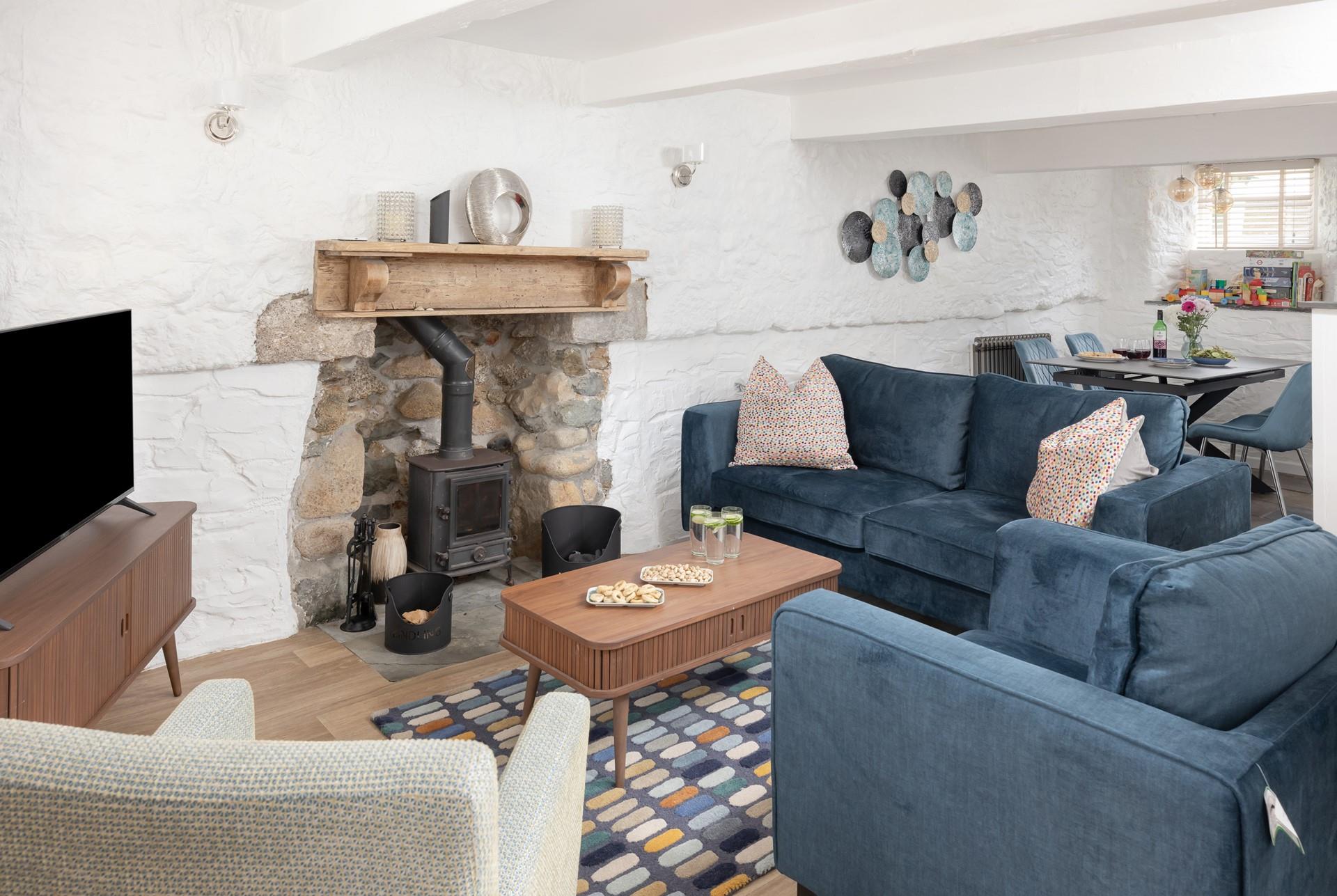 Spend days wandering the pretty harbourside or relaxing on the beaches before returning to this charming cottage.
