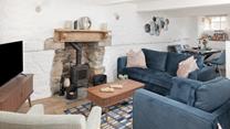 Spend days wandering the pretty harbourside or relaxing on the beaches before returning to this charming cottage.