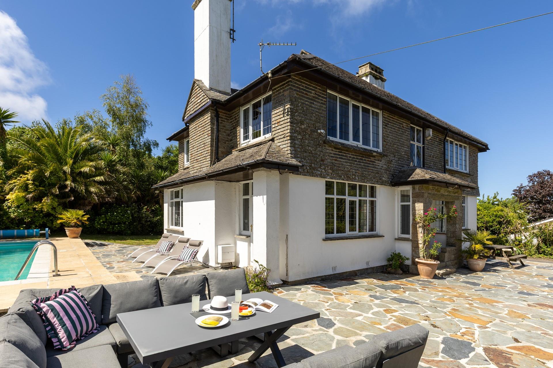 Set within private gardens, this charming retreat is perfect for a family getaway.
