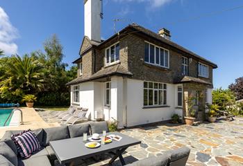 Set within private gardens, this charming retreat is perfect for a family getaway.