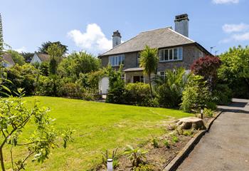 The ample garden offers plenty of space for little ones to play!