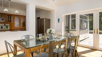 The open plan kitchen and dining area is a social space, perfect for holiday mealtimes.