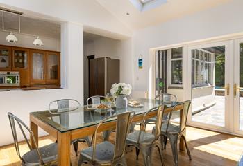 The open plan kitchen and dining area is a social space, perfect for holiday mealtimes.