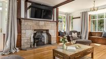 Traditional features meet modern styling in the spacious sitting room.