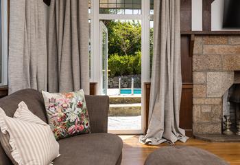 The sitting room has direct garden access, from the sofa to the pool in seconds!