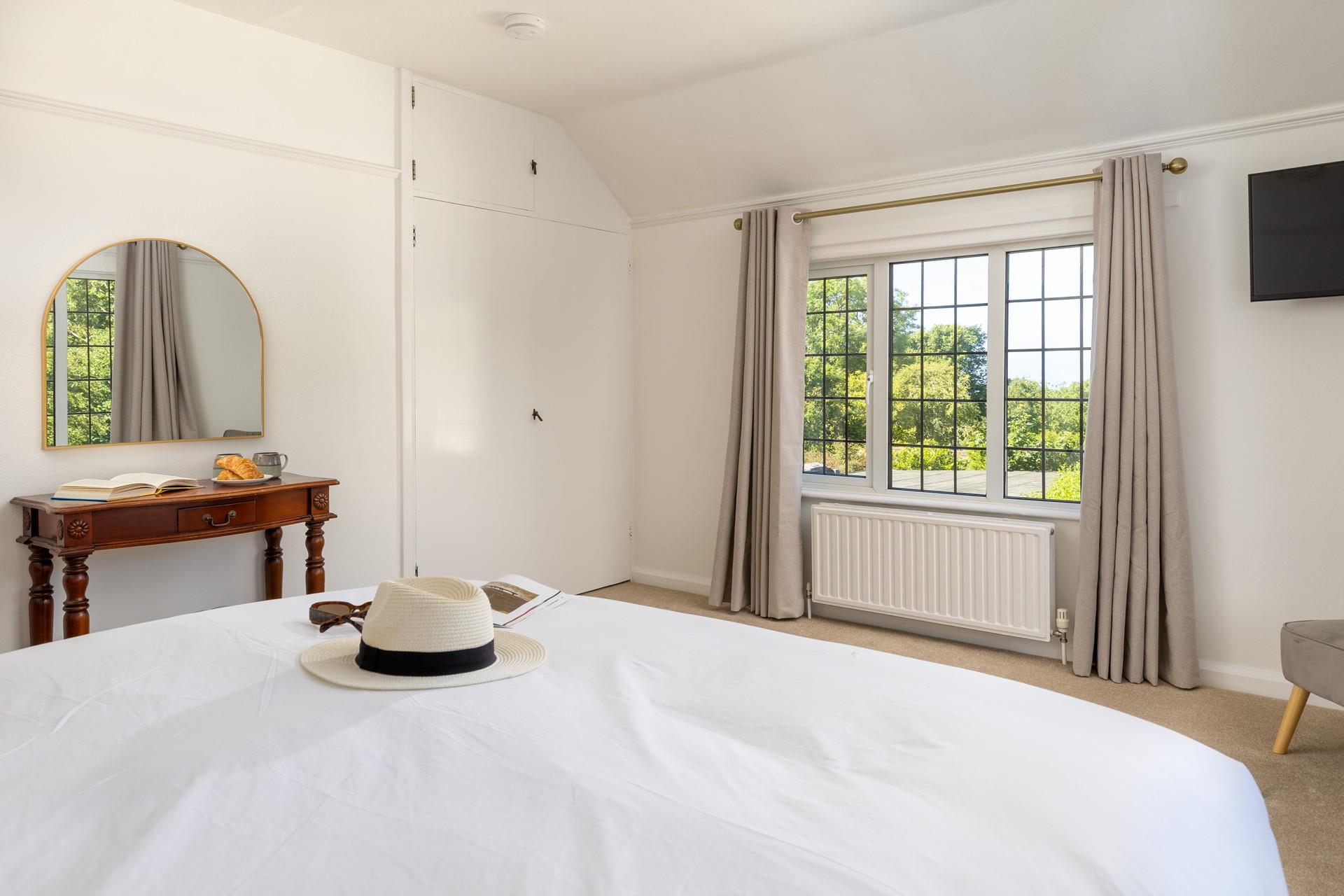 Bright and spacious, bedroom 2 has all you need to relax in comfort.
