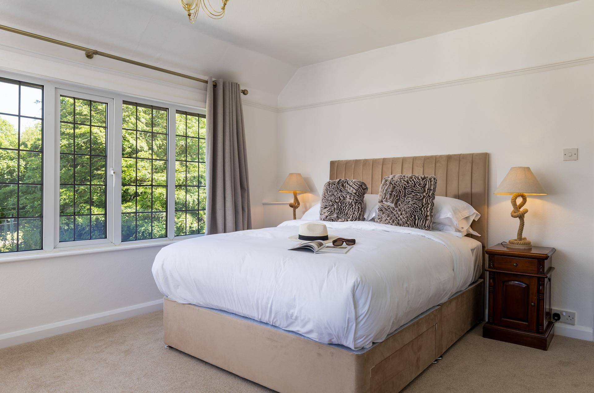 Light and airy bedroom 2 blends natural textures with classic features.