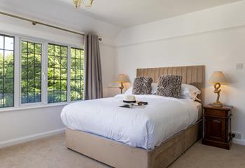 Light and airy bedroom 2 blends natural textures with classic features.