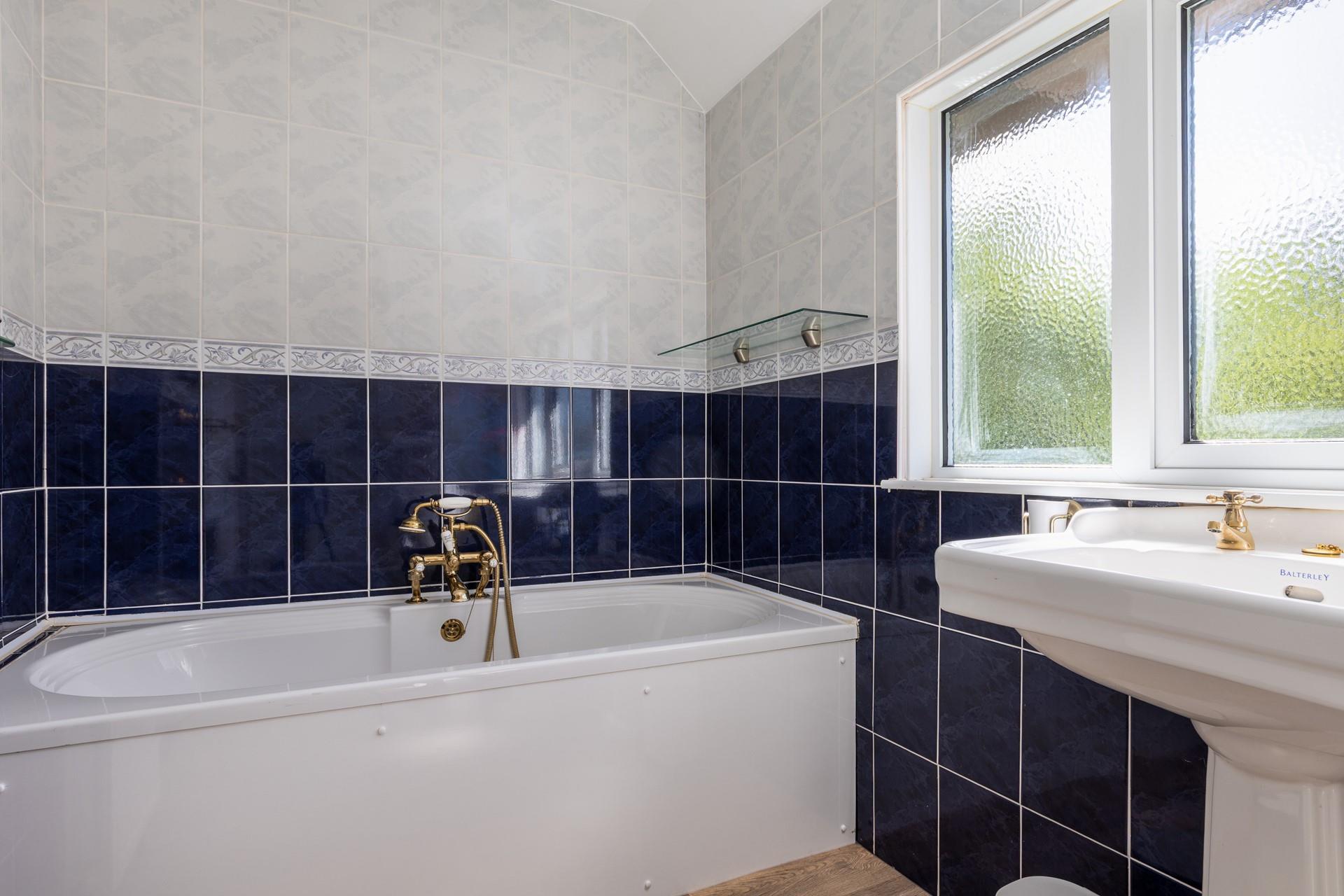 The family bathroom has a bath, perfect for soaking after a ramble along the coast path.