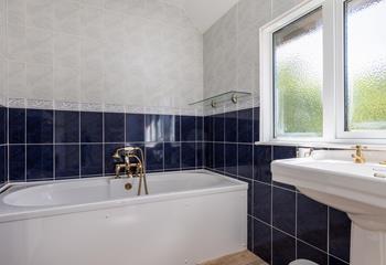 The family bathroom has a bath, perfect for soaking after a ramble along the coast path.