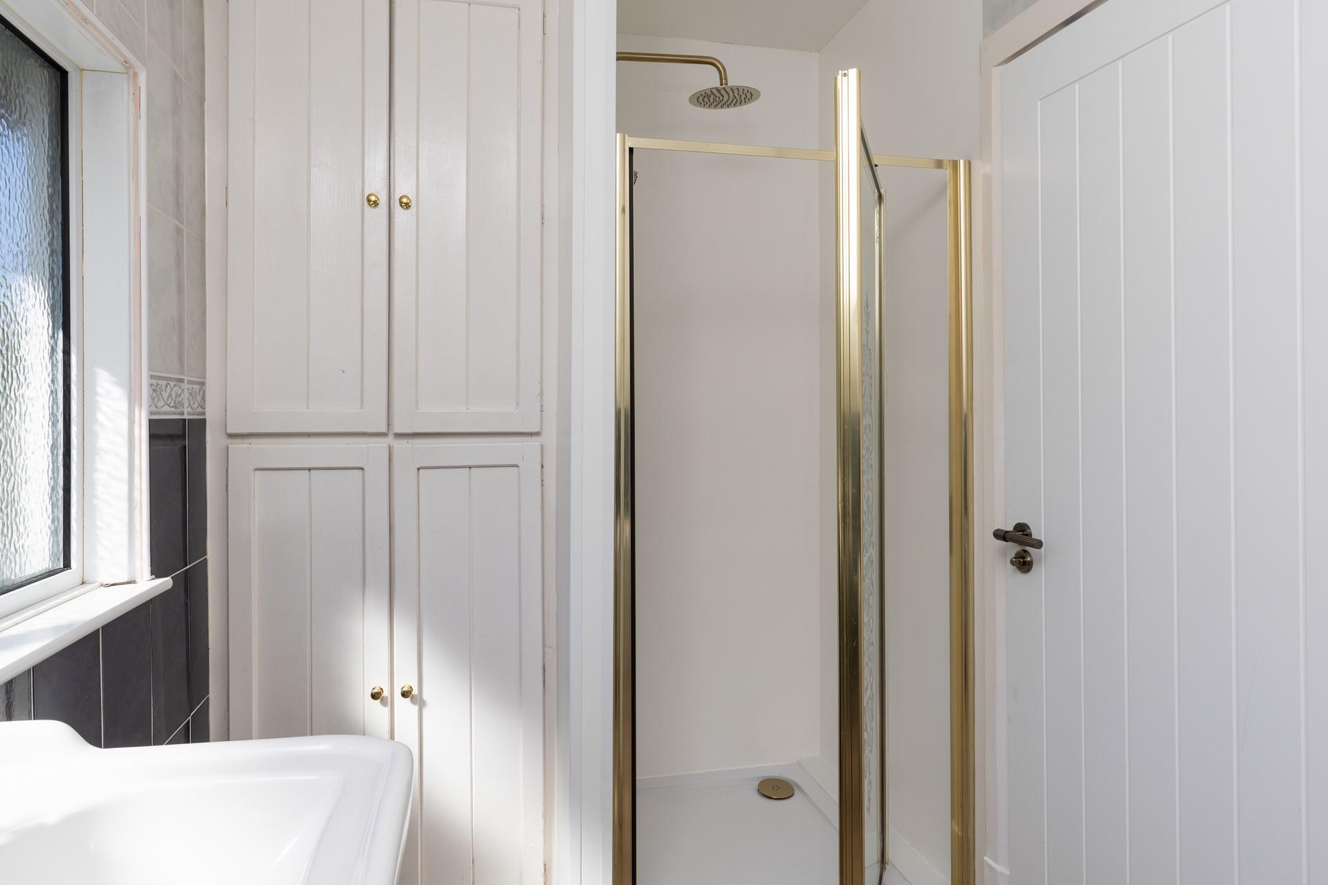 After a day at the beach, step into the invigorating rainfall shower.